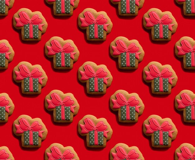 Gift box pattern. Women Day. Red seamless background. Holiday surprise. Creative beige green gingerbread present design cookie minimalist symmetrical composition isolated on bright.