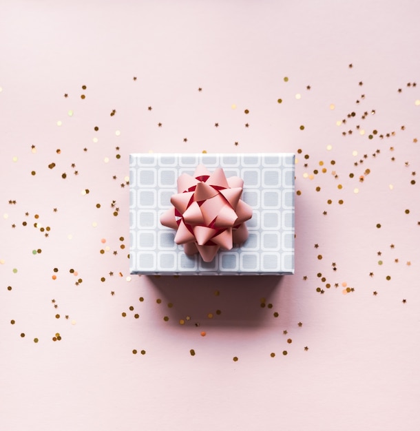 Gift box on pink background.