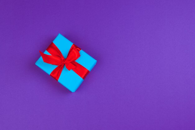 Gift box on purple background