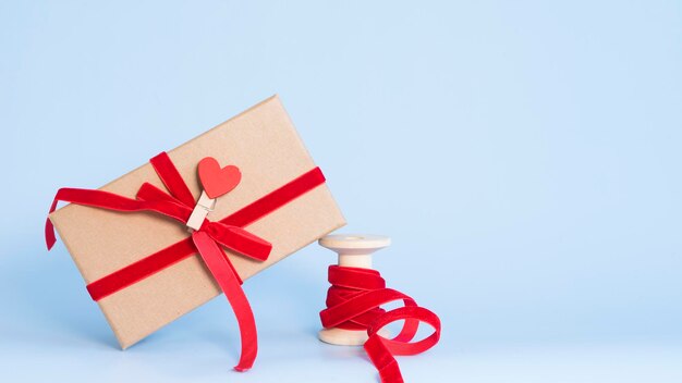 Gift box and ribbon on blue background