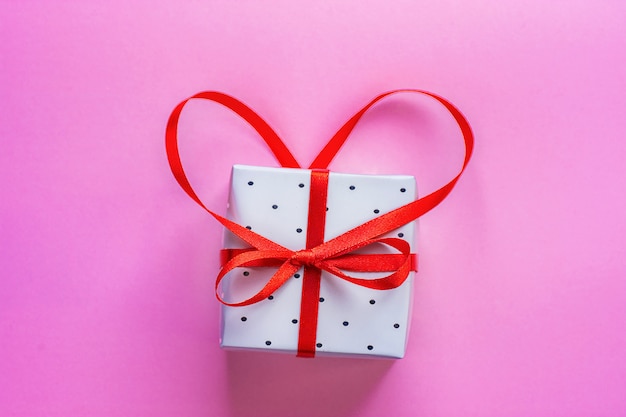 Photo gift box tied with red ribbon