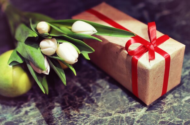 Gift box and white tulips