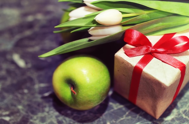 Gift box and white tulips