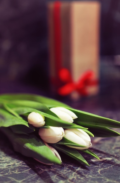 Gift box and white tulips