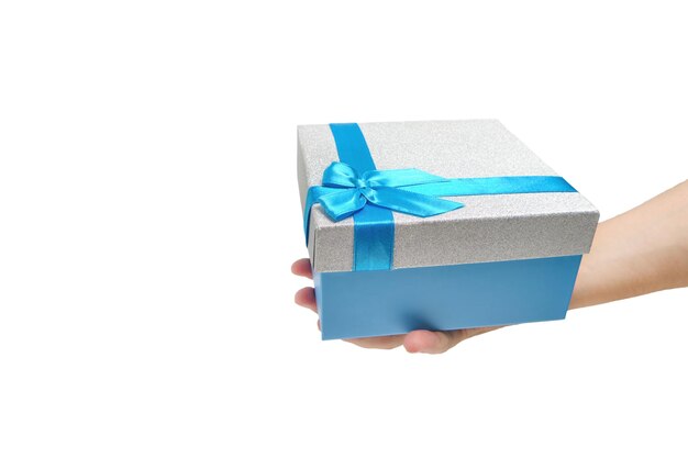 Gift box with blue ribbon and bow in hand white background