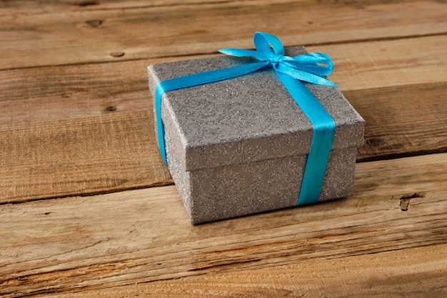 Gift box with blue ribbon