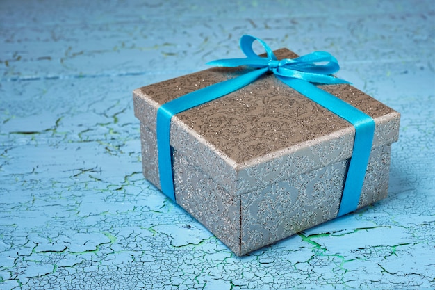 Gift box with blue ribbon