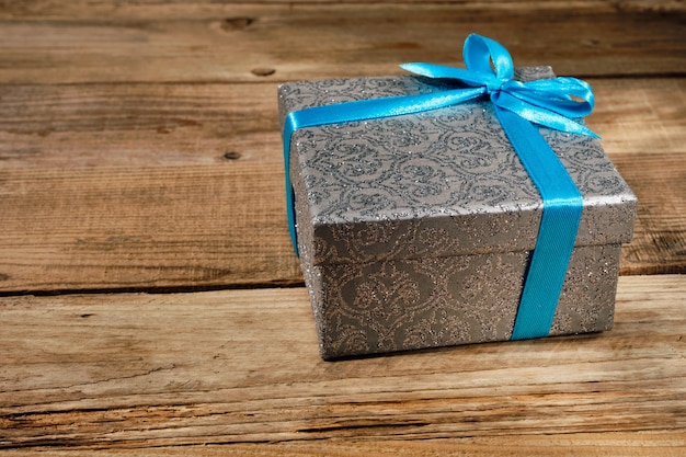 Gift box with blue ribbon