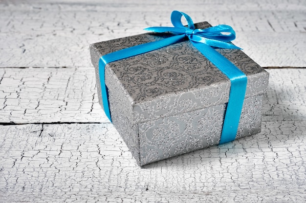 Gift box with blue ribbon