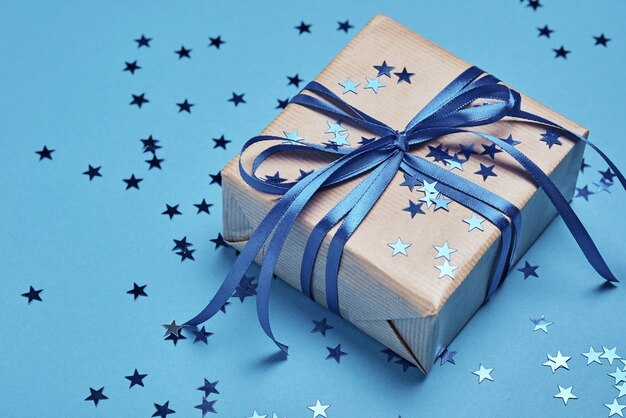 Gift box with bow and confetti