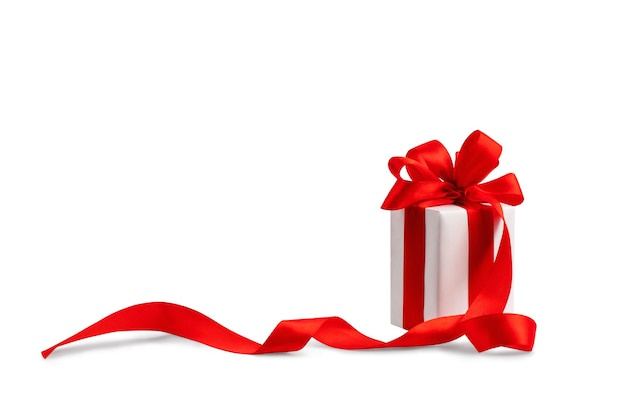 Gift box with a bow made of red satin ribbon isolate on a white background