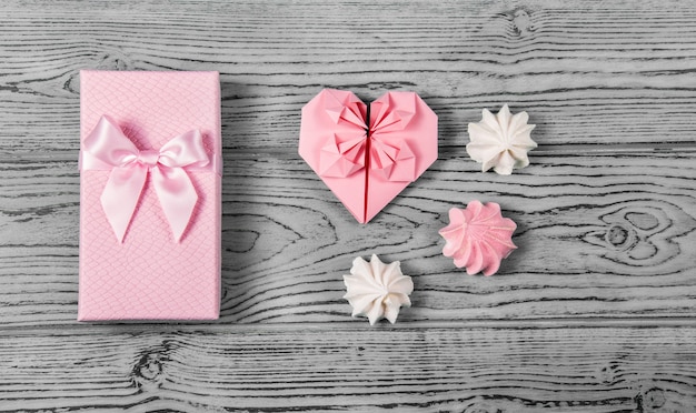 Gift box with bow and paper heart. Romantic gift