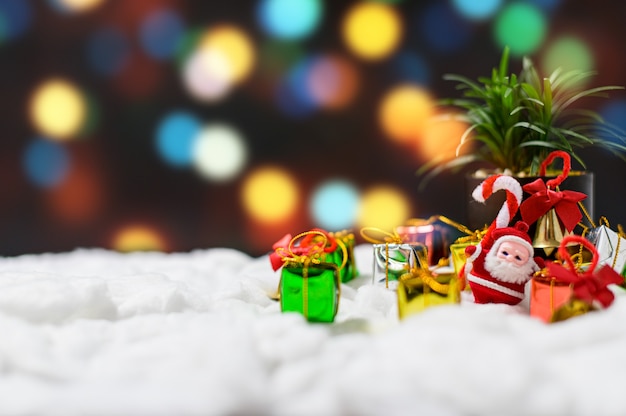 gift box with christmas decoration on snow