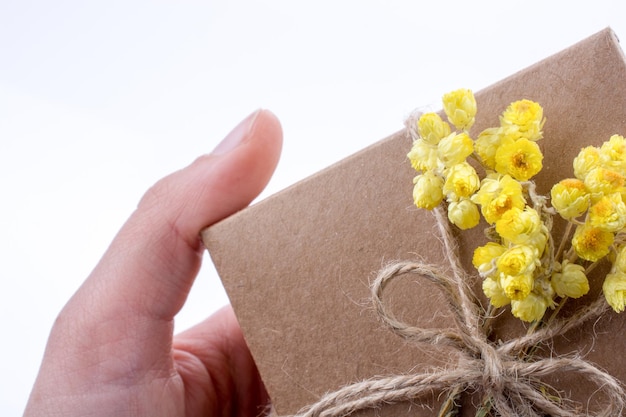 Gift Box with Flowers in hand