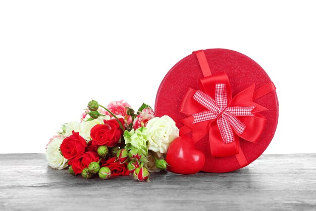 Gift box with flowers on white background