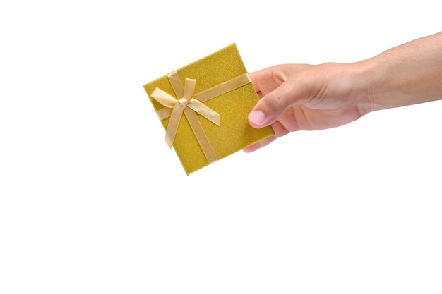 Gift box with gold ribbon and bow in hand white background