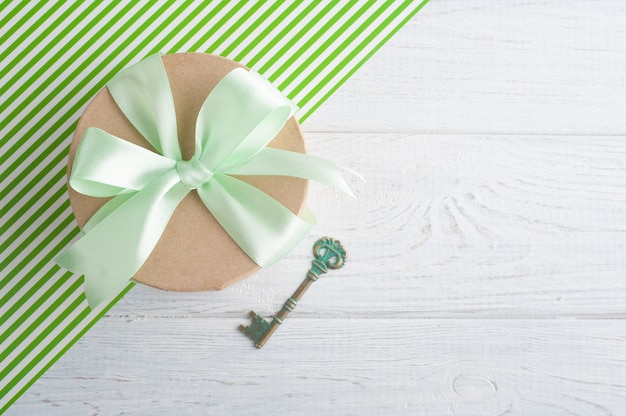 Gift box with green ribbon 