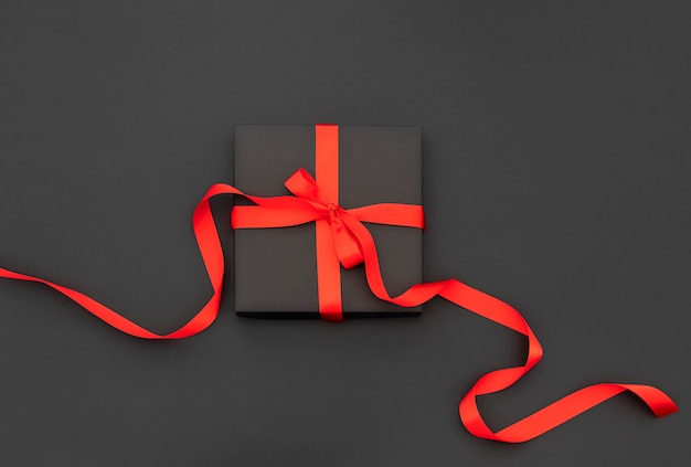 gift box with red bow and ribbons.