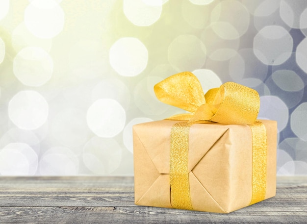 Gift box with ribbon on  background