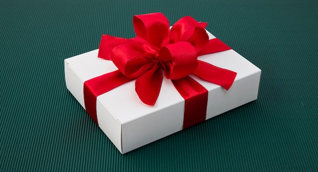 Gift Box with Ribbon on green paper