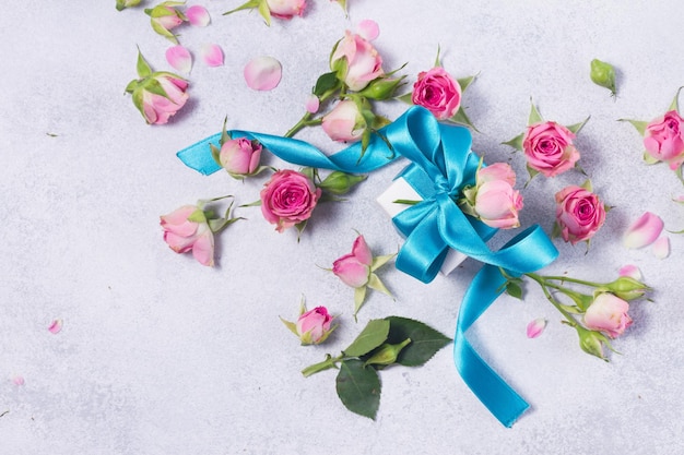 Gift box with satin bow and flowers