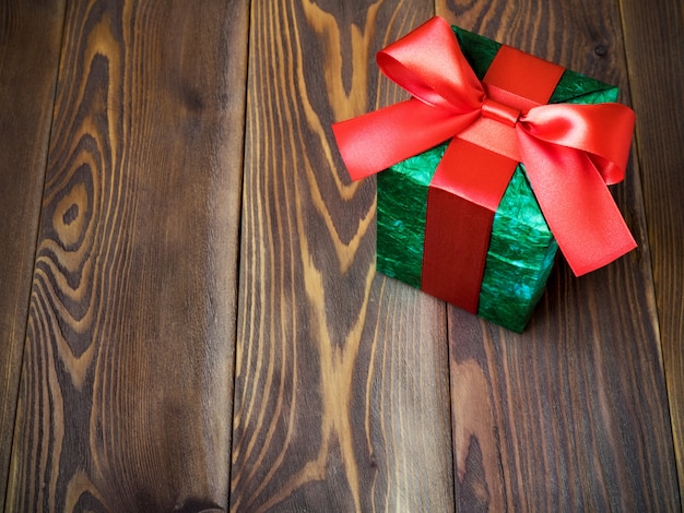 Gift box on the wooden board