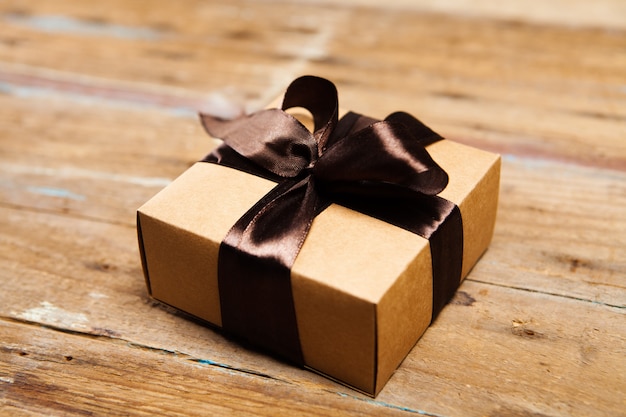 Gift box on wooden surface