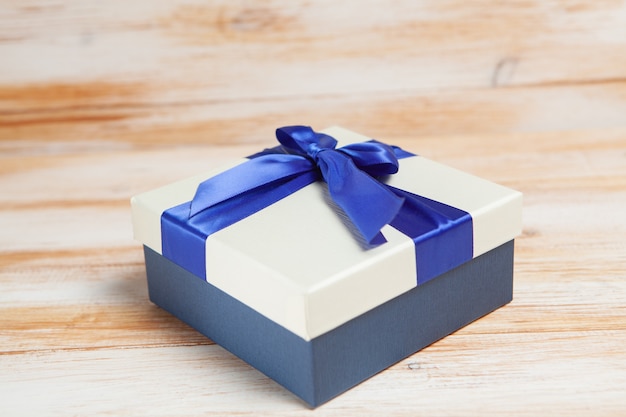 Gift box on wooden table