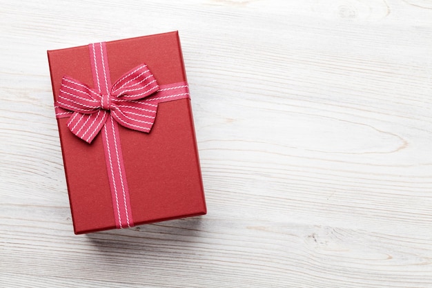 Gift box on wooden table