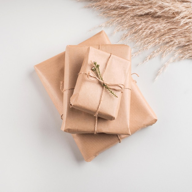 Gift box wrapped in craft paper with dried flowers