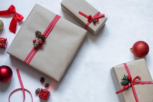 Gift box wrapped in paper with red ribbon