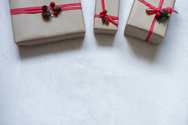 Gift box wrapped in paper with red ribbon