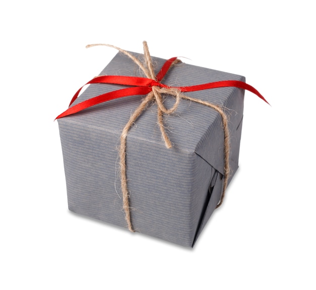 Gift box wrapped with gray paper and satin ribbon, decorated with craft rope, isolated on white
