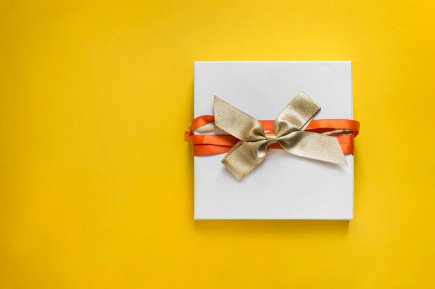 Gift box on yellow background