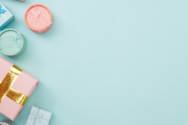 Gift boxes on blue pastel background, copy space, Flatlay