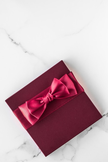 Gift boxes on marble background holiday flatlay