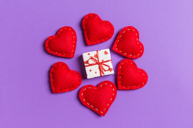 gift boxes and red textile hearts. Top view of Valentine's Day concept