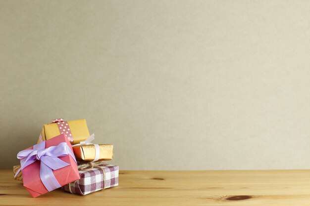 Gift boxes on table against wall