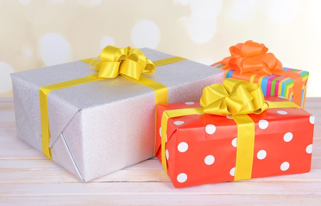 Gift boxes on table on light background