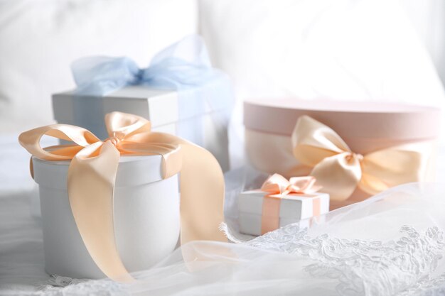 Gift boxes for wedding day on bed