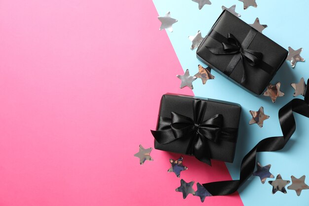 Gift boxes with black bow on two tone 