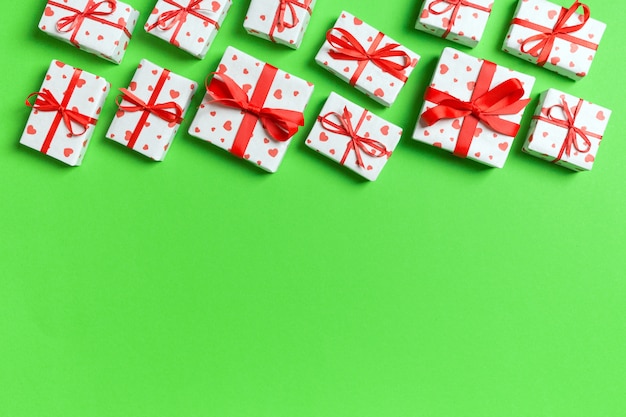 Photo gift boxes with hearts wrapping paper on green