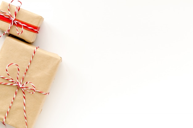 Gift boxes wrapped with craft paper on white 