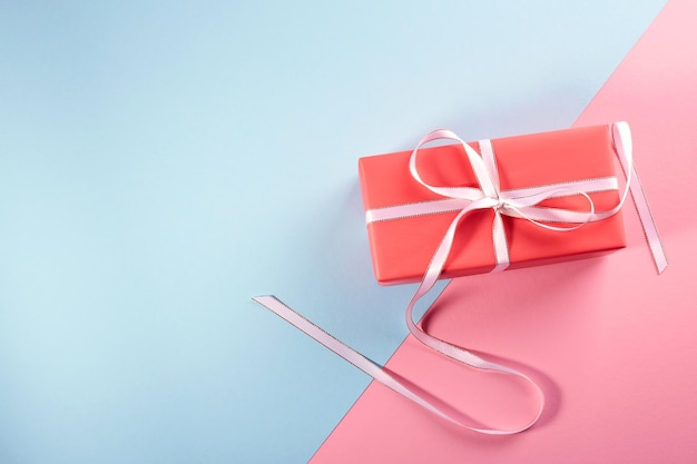 Gift in bright packaging Pinkblue background