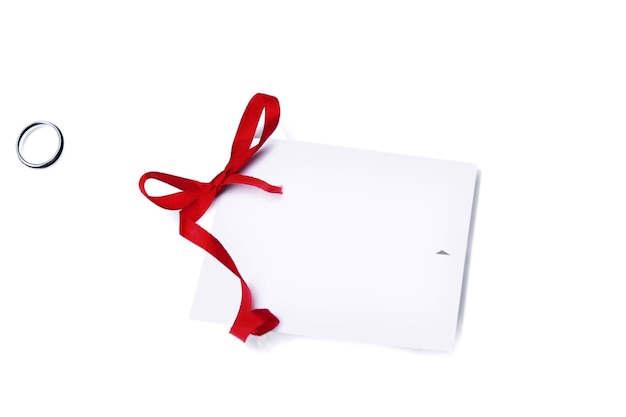 Photo gift card note with red ribbon on white background