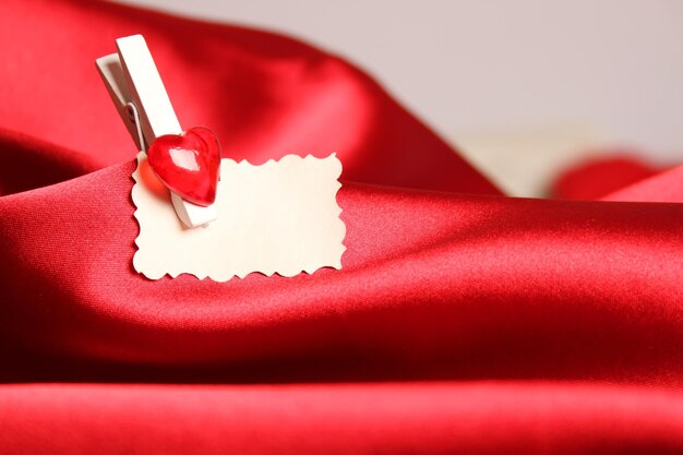 Gift card for Valentine39s Day on a red silk