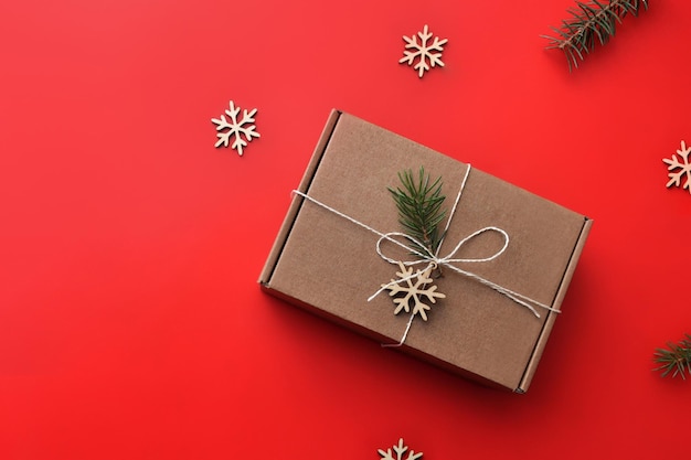 Gift cardboard box with Christmas decor on the table