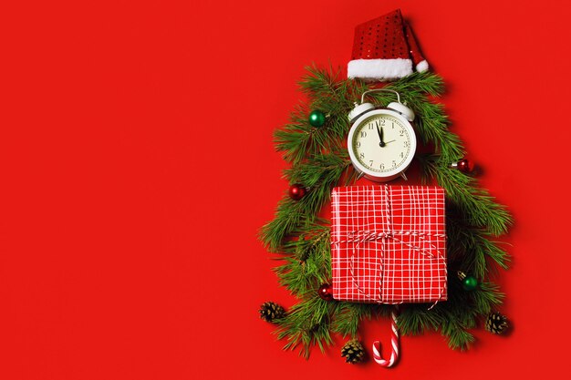 Foto orologio regalo cappello di babbo natale a forma di albero di natale