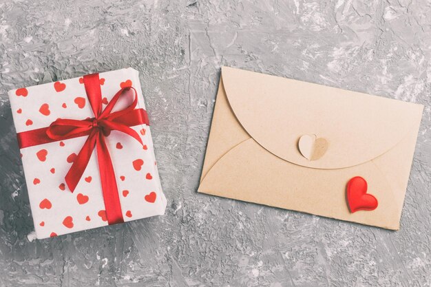 Photo gift and envelope on table during valentine day
