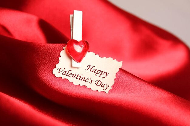 Gift greeting card for Valentine39s Day on a red silk